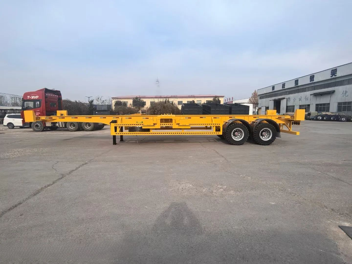 Skeletal container chassis trailer loaded with a 40ft shipping container
